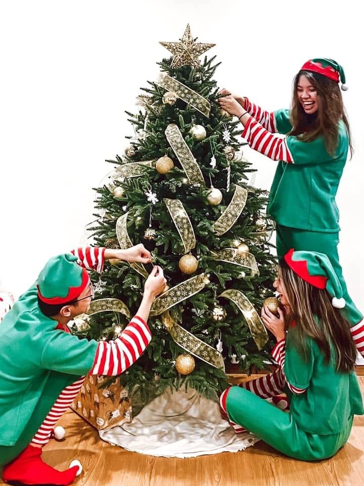 Elves hanging Christmas decorations