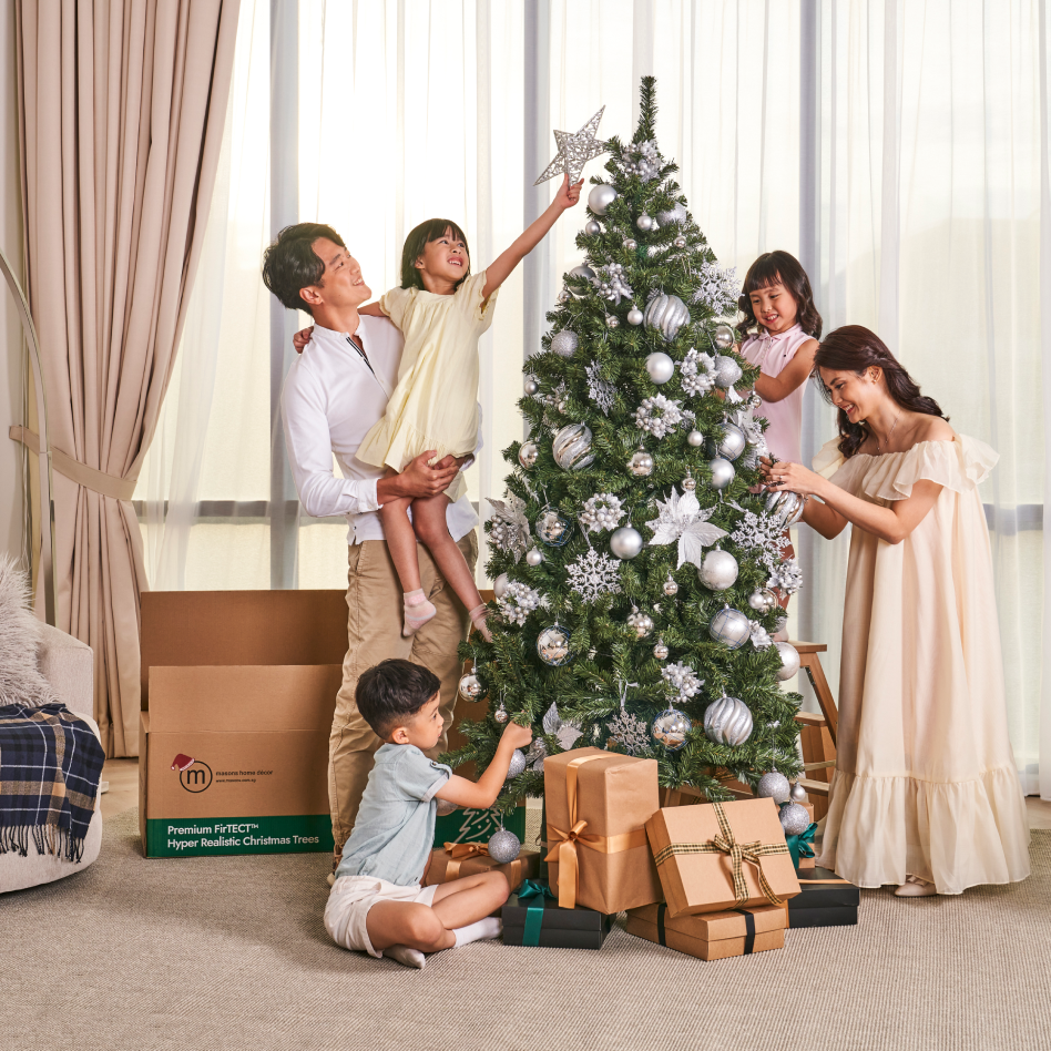 Singapore family hanging Christmas tree decorations