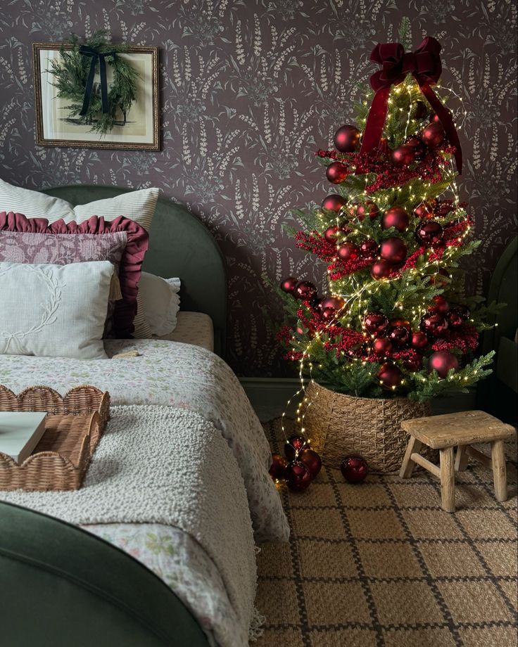 Small burgundy Christmas tree in a bedroom