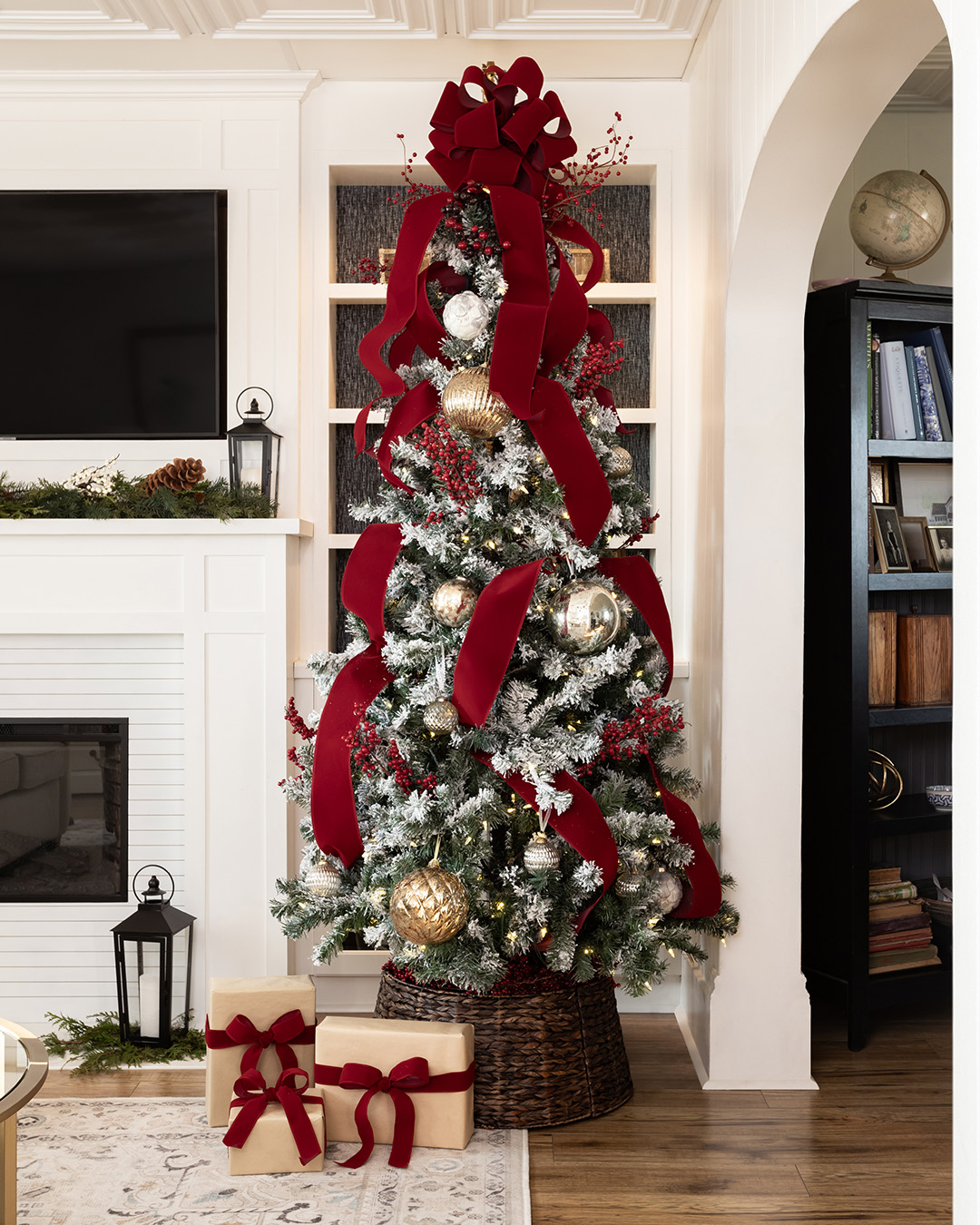 Flocked Christmas tree with red bow
