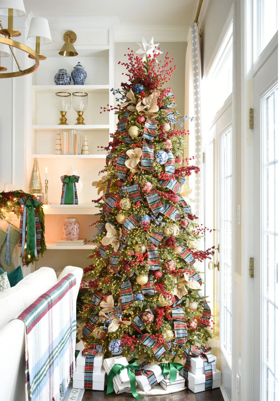 Red, blue, and gold scholarly themed Christmas tree