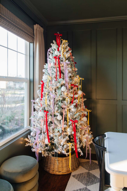 Flocked Christmas tree full of ribbons
